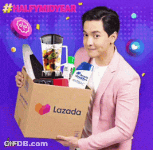A Man In A Pink Suit Is Holding A Lazada Box Full Of Items GIF