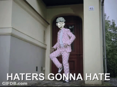 A Man In A Pink Suit Is Standing In Front Of A Door That Says 45 On It GIF