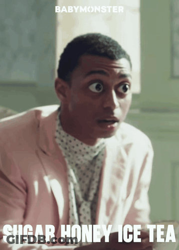 A Man In A Pink Suit With The Words Sugar Honey Ice Tea Written Below Him GIF