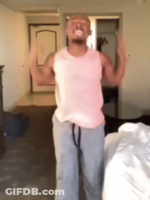 A Man In A Pink Tank Top And Grey Sweatpants Is Dancing GIF