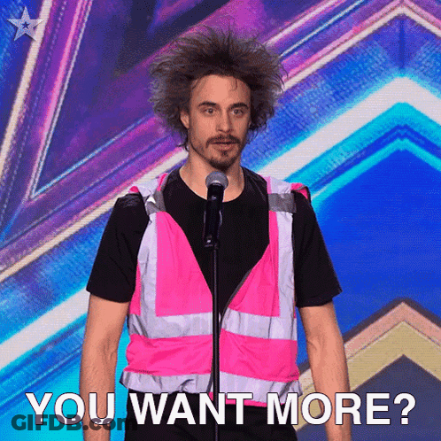 A Man In A Pink Vest Stands In Front Of A Microphone With The Words " You Want More " Below Him GIF
