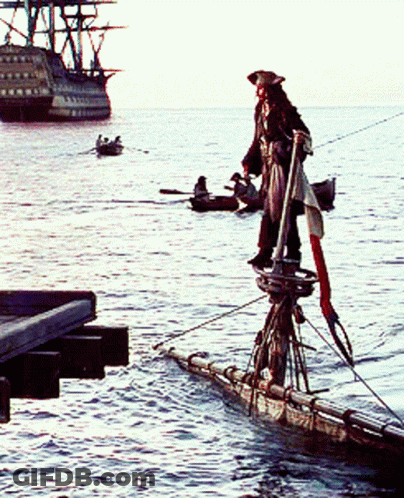 A Man In A Pirate Costume Is Standing On A Raft In The Ocean GIF