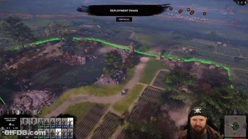 A Man In A Pirate Headband Is Playing A Video Game Called Deployment Phase GIF
