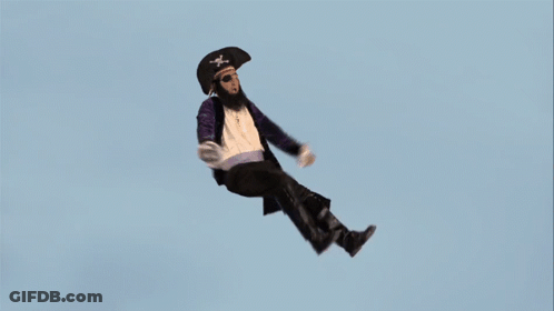 A Man In A Pirate Outfit Is Falling Through The Air GIF