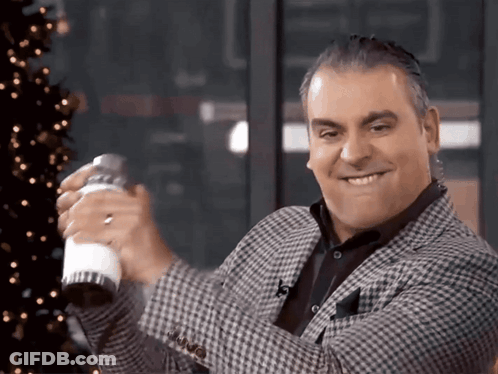 A Man In A Plaid Jacket Holds A Shaker In His Hand GIF