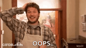 A Man In A Plaid Shirt And Apron Is Holding His Head And Saying `` Oops '' . GIF
