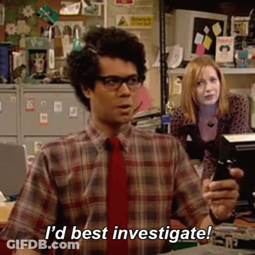 A Man In A Plaid Shirt And Tie Is Holding A Cell Phone And Saying `` I 'D Best Investigate ! '' GIF