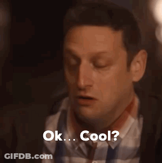 A Man In A Plaid Shirt And Tie Is Saying Ok . Cool . GIF