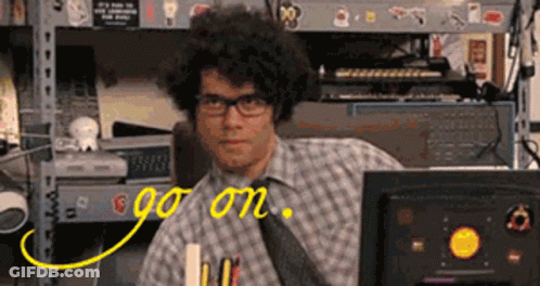 A Man In A Plaid Shirt And Tie Is Sitting In Front Of A Computer With The Words Go On Written On The Screen GIF