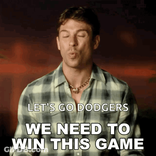 A Man In A Plaid Shirt Blows A Kiss With The Words Let 'S Go Dodgers We Need To Win This Game Below Him GIF