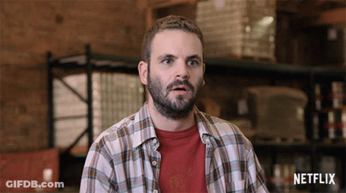Man In Plaid Shirt With Netflix Logo GIF