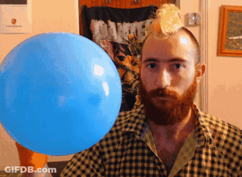 A Man In A Plaid Shirt Holds A Blue Balloon GIF