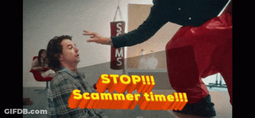A Man In A Plaid Shirt Is Being Kicked In The Face By A Man In Red Shorts GIF