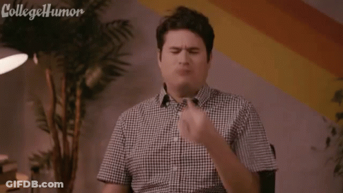 A Man In A Plaid Shirt Is Holding A Piece Of Coal In His Mouth And Says Ug , Black Lung . GIF
