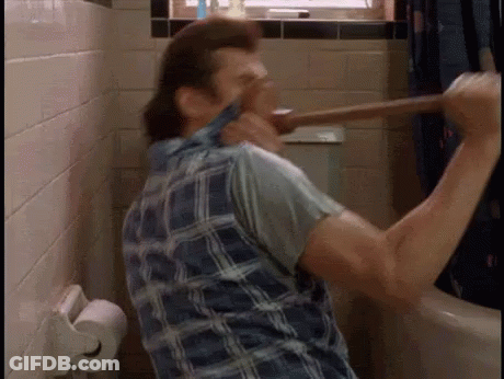 A Man In A Plaid Shirt Is Holding A Plunger In His Mouth In A Bathroom . GIF