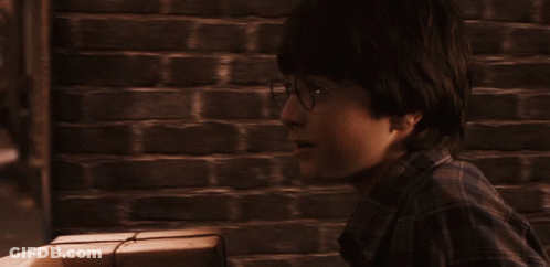 A Man In A Plaid Shirt Is Looking At Something In The Distance GIF