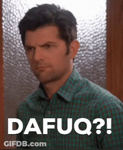 A Man In A Plaid Shirt Is Making A Funny Face And Saying Dafuq ? GIF