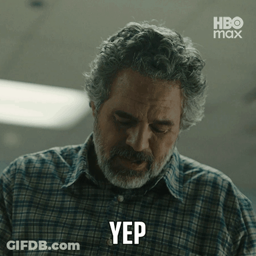 A Man In A Plaid Shirt Is Making A Yep Gesture GIF