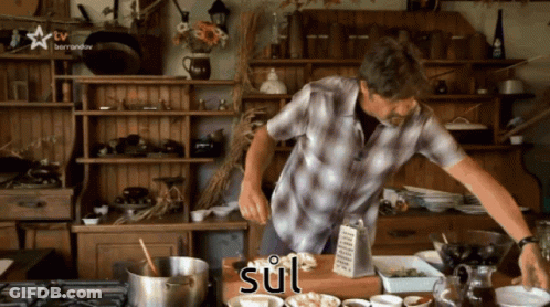 A Man In A Plaid Shirt Is Preparing Food In A Kitchen With The Word Sul Written On The Counter GIF