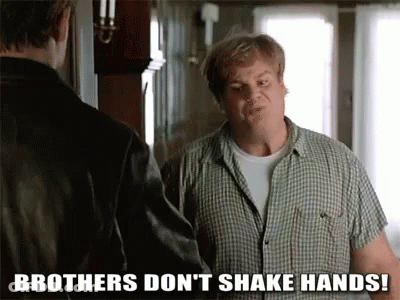 A Man In A Plaid Shirt Is Shaking Hands With Another Man And Says Brothers Don 'T Shake Hands ! GIF