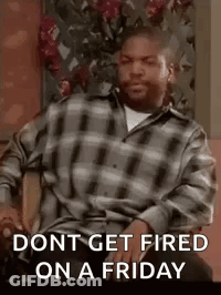 A Man In A Plaid Shirt Is Sitting In A Chair With The Words `` Dont Get Fired On A Friday '' . GIF
