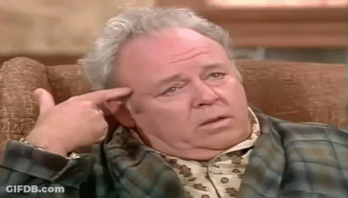 Man In Plaid Shirt Sitting On Couch GIF