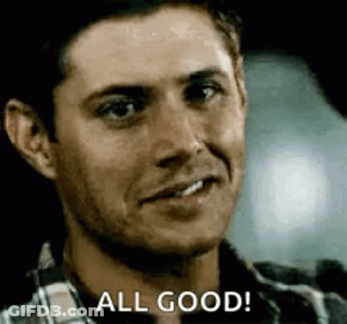 A Man In A Plaid Shirt Is Smiling And Saying All Good . GIF