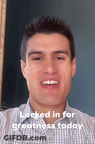 A Man In A Plaid Shirt Is Smiling With The Words " Locked In For Greatness Today " Below Him GIF