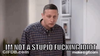 A Man In A Plaid Shirt Is Standing In A Room And Says `` I 'M Not A Stupid Fucking Idiot '' GIF