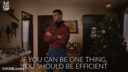 A Man In A Plaid Shirt Is Standing In Front Of A Christmas Tree With The Words If You Can Be One Thing You Should Be Eff GIF