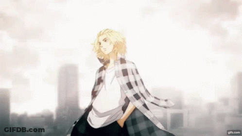 A Man In A Plaid Shirt Is Standing In Front Of A City Skyline With His Hands In His Pockets . GIF