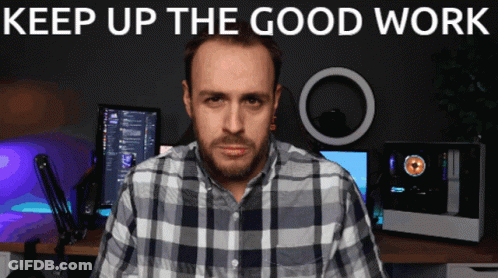A Man In A Plaid Shirt Is Standing In Front Of A Computer Monitor With The Words " Keep Up The Good Work " Above Him GIF