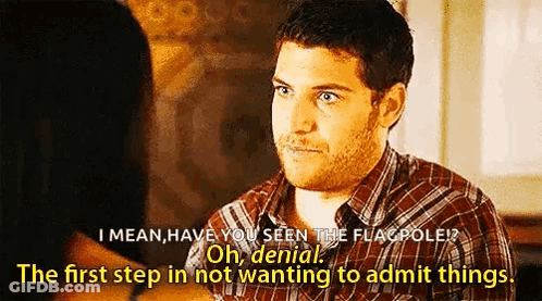Man In Plaid Shirt Talking To Woman GIF