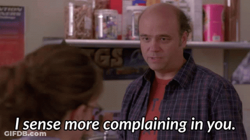 A Man In A Plaid Shirt Is Talking To A Woman Who Says I Sense More Complaining In You GIF