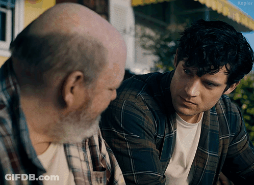 A Man In A Plaid Shirt Is Talking To An Older Man With The Word Kepler Visible In The Corner GIF
