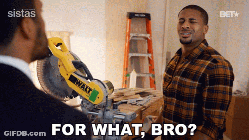 A Man In A Plaid Shirt Is Talking To Another Man In Front Of A Walt Saw GIF