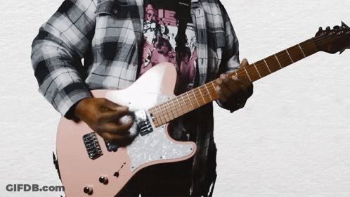 A Man In A Plaid Shirt Playing A Pink Guitar GIF