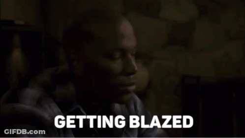 A Man In A Plaid Shirt Says Getting Blazed In A Dark Room GIF