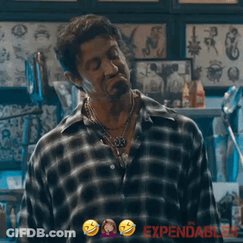 A Man In A Plaid Shirt Says I 'M Good In A Tattoo Shop GIF