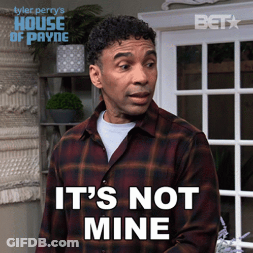 A Man In A Plaid Shirt Says It 'S Not Mine In Front Of A Window GIF
