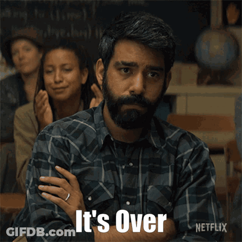 A Man In A Plaid Shirt Says " It 'S Over " In Front Of A Group Of People GIF