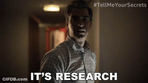 A Man In A Plaid Shirt Says It 'S Research In A Hallway GIF