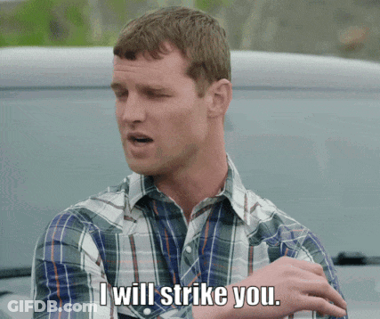 A Man In A Plaid Shirt Says That He Will Strike You GIF