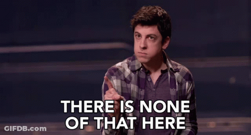 A Man In A Plaid Shirt Says There Is None Of That Here In A Dark Room . GIF