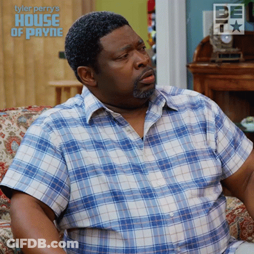A Man In A Plaid Shirt Sits On A Couch With The Words Tyler Perry 'S House Of Payne GIF