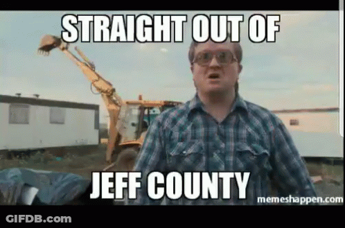 A Man In A Plaid Shirt Stands In Front Of A Bulldozer With The Caption Straight Out Of Jeff County GIF