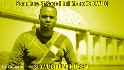 A Man In A Plaid Sweater Stands In Front Of A Building With The Caption " Sean Fury Bi-Racial Girl Meme Slowed " GIF