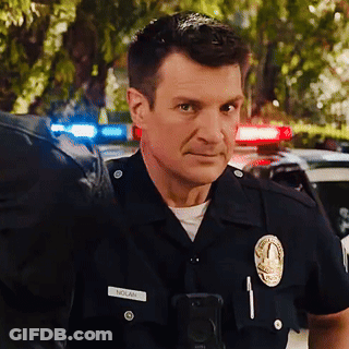 A Man In A Police Uniform Has The Name Nolan On His Badge GIF