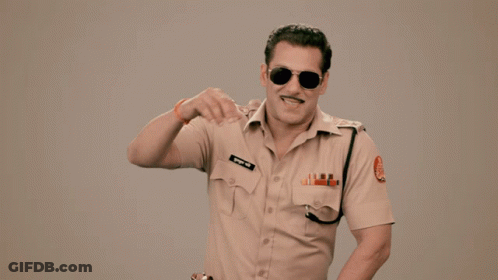 A Man In A Police Uniform Has The Word Lol Written On His Shirt GIF