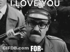 A Man In A Police Uniform Is Holding A Gun And Says I Love You For GIF